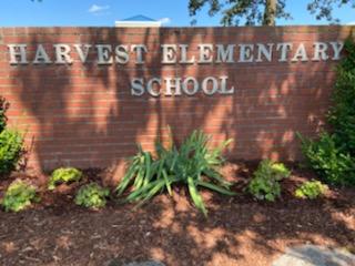 HarvestElem's tweet photo. Thanks to those that helped make our campus beautiful! Trav-Ad Signs made an awesome marquee w/ our logo & a @BRSOE sign. Thanks to those who volunteered to plant shrubs & clean out landscaping! #ThisIsHarvest #WritingOurStory #1Sparkman #IgniteExcellenceMCSS @ChrisGunnelsHES https://t.co/1ZZc3T0HEb