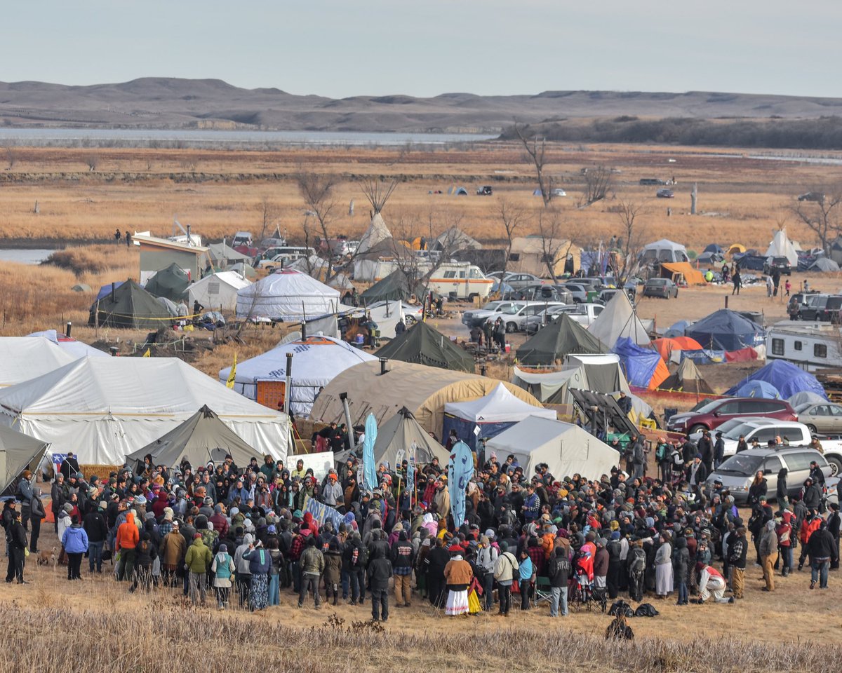  #NODAPL365 Day 7:During the height of the movement, hundreds of new people would arrive daily and begin taking NVDA (non-violent direct action) training to understand what was and was not acceptable on the frontlines. In this photo hundreds of new arrivals begin training.