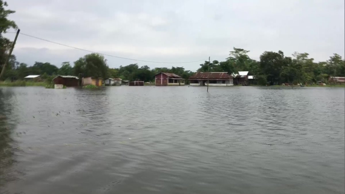 ANI's tweet photo. Assam: Villages in Dibrugarh flooded after the water level of Brahmaputra river rises following incessant rainfall in the region; normal life disrupted. https://t.co/D0T53SkTk3