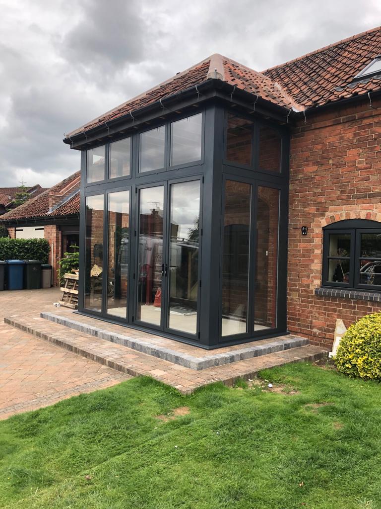 nott_win's tweet photo. Grey aluminium porch with dummy sashes including highly impressive 2500mm high french door as apposed to your average 2100mm. Installed in Edwalton, Nottingham. For a free quotation call us on 01158 660066, visit https://t.co/xYsFES5G8H or pop into our West Bridgford showroom. https://t.co/c3uSGdFCQq