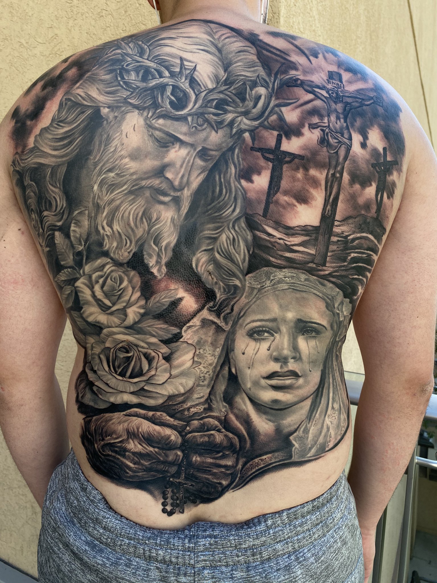 Details 68+ religious back tattoos best