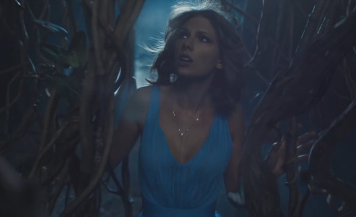 Although she was not wearing the exact same necklace in the 'Out Of The Woods' music video, she was seen holding it in the 'Style' music video.