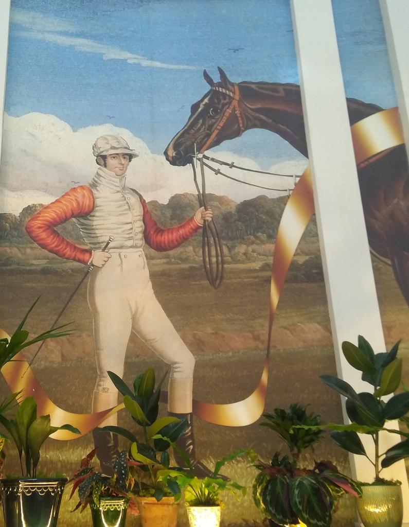 According to this painting in <a href="/ivycheltenham/">The Ivy Cheltenham</a>, it would appear that <a href="/McIlroyRory/">Rory McIlroy</a> was a jockey in a previous life... Putting the Rider in Ryder Cup #COVIDcareerchange