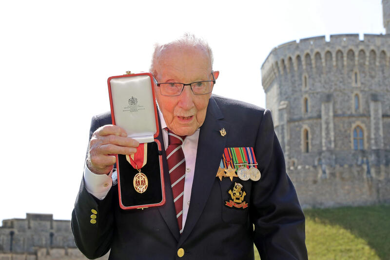 reuterspictures's tweet photo. Queen Elizabeth knights Captain Tom Moore, recognizing the 100-year-old for lifting Britain’s spirits during the gloom of the coronavirus pandemic by raising millions of pounds for health workers. Read more: https://t.co/55u4f3X6WG https://t.co/QWWTp8rT7j