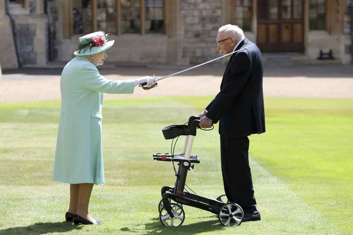 On a day infused with emotion, Queen Elizabeth II tapped the blade of a sword once owned by her father on the slender shoulders of 100-year-old Tom Moore, making a hero of a nation a knight of the realm. cp24.to/C3z63dU