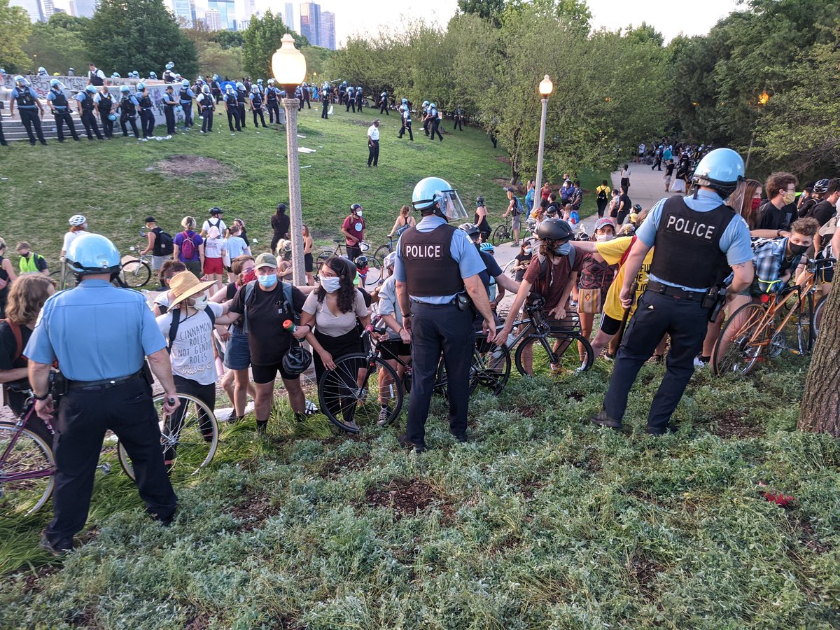 Taking bikes CPD pushing ppl off wall. One said Trump2020. Thin blue line black and white mask.  #Zhigaagoong  #chicagoprotest