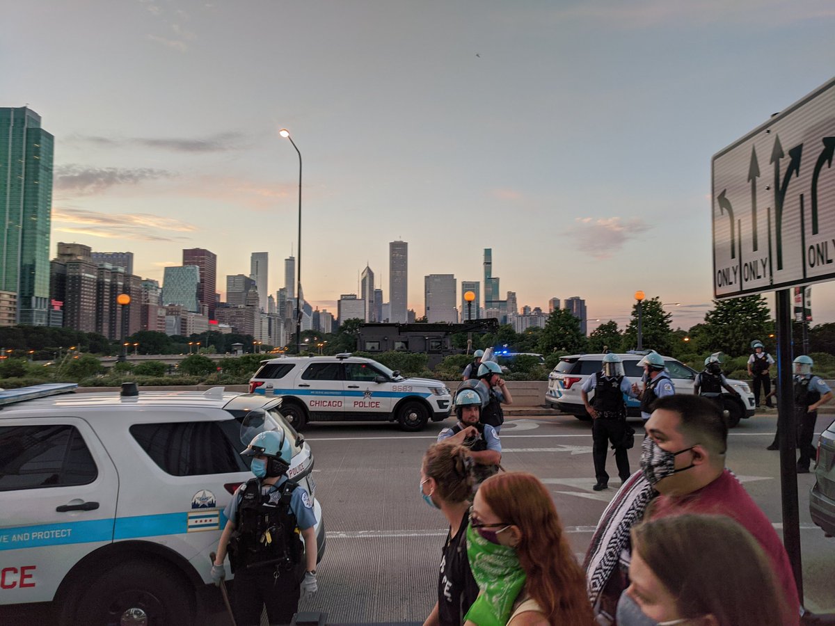 That's a SWAT van. Herded onto bridge. Some cops taunting protesters saying "See you tomorrow"  #Zhigaagoong  #chicagoprotest