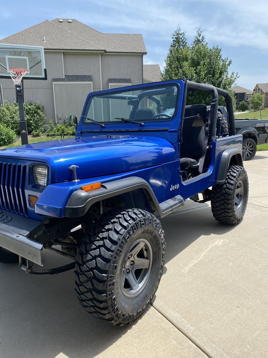 MPURMORT's tweet photo. Old Blue Jeep YJ got new shoes for its 25th birthday today. Wife adopted it when it was 1 https://t.co/S3KqFRpIQh