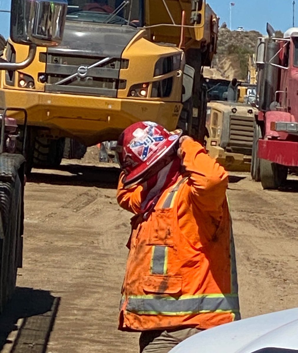 LaikenJordahl's tweet image. This #BorderWall worker desecrating Kumeyaay land has a confederate flag on his hardhat.

The wall is a monument to white supremacy.