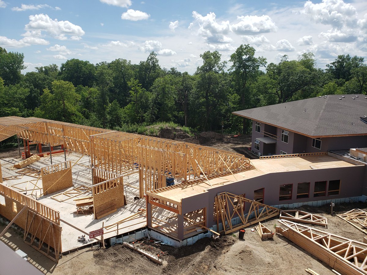 TylerK78's tweet photo. Construction continues on the Boyne Lodge Personal Care Home Project. The community space and link between the buildings is starting to take shape. A lot of work is taking place inside each of the homes. It's exciting to see the progression of the project. #carmanmb #carmanecodev https://t.co/aUd4nOyYCZ