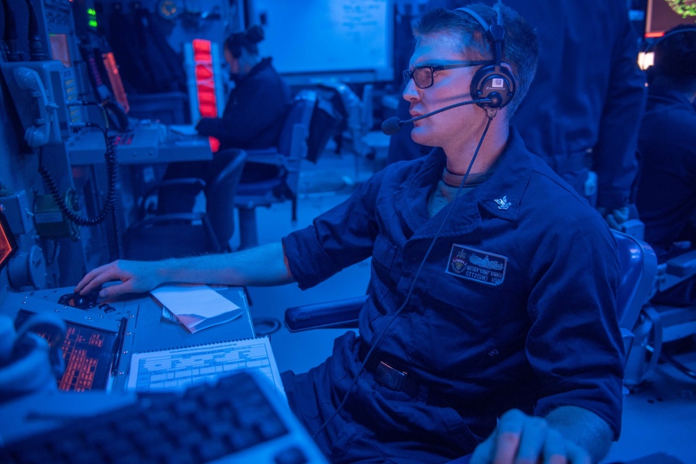 USPACOM's tweet photo. Sailors assigned to the @USPacificFleet guided-missile cruiser USS Antietam #CG54 stand watch in the shipβs Combat Information Center while deployed to the South China Sea. #ForgedByTheSea #Watchstander #FreeandOpenIndoPacific. https://t.co/ZdJxQrmG4v