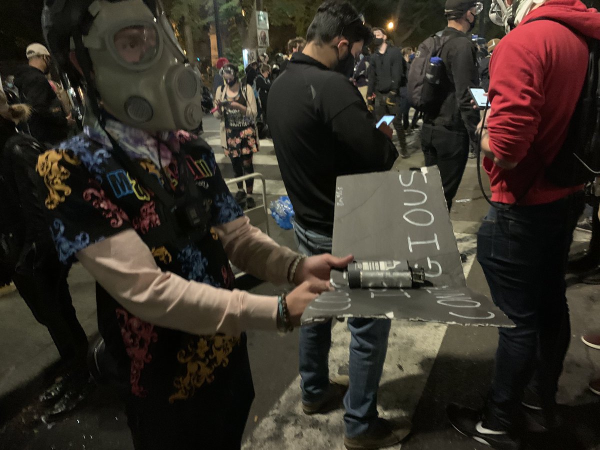 A protestor holds spent munitions