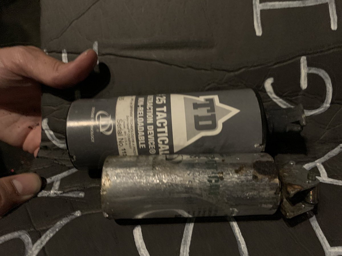 A protestor holds spent munitions