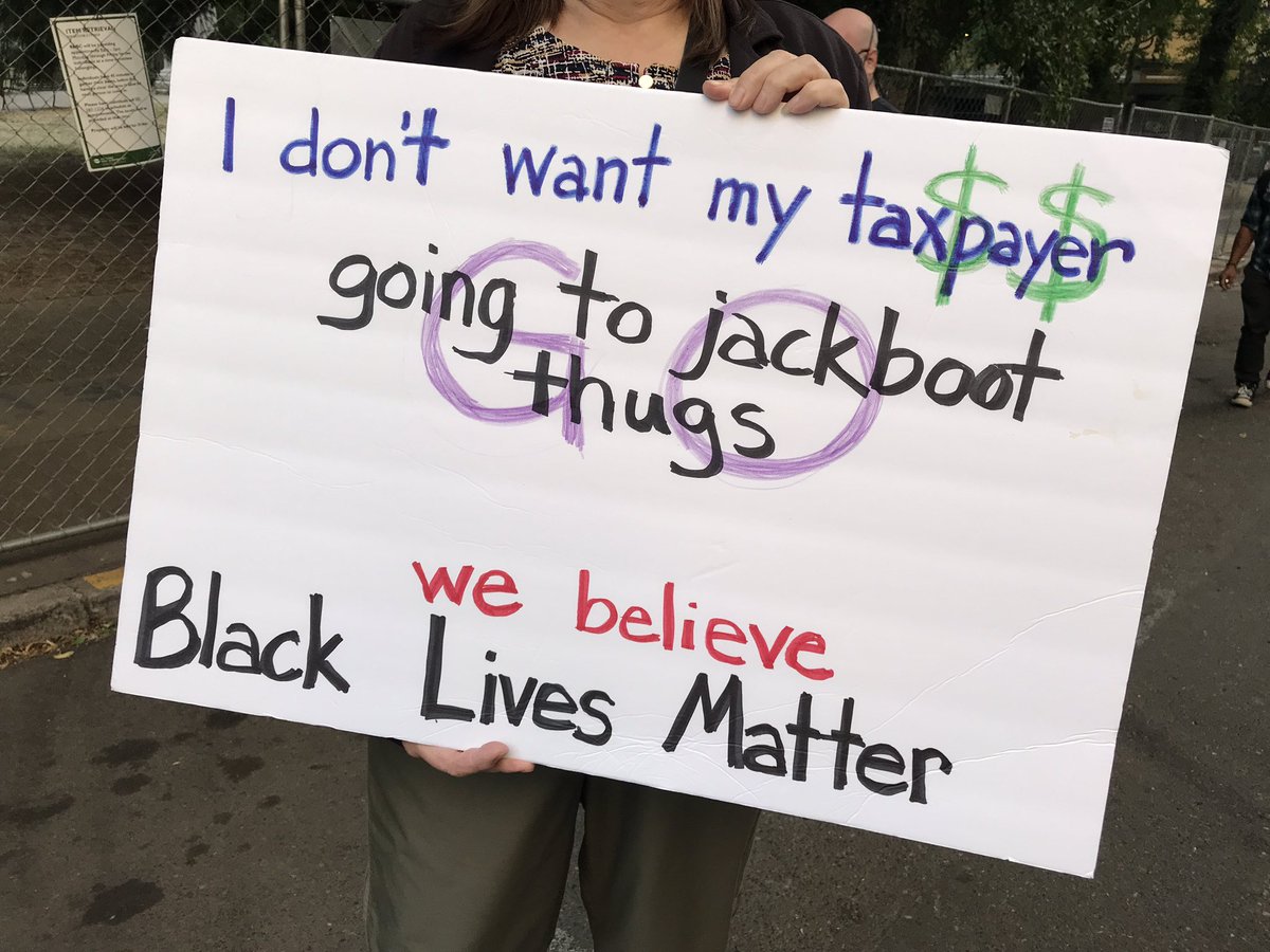 The woman holding this sign resembled a typical white suburban mom. She said she was glad journalists came to show the world that it’s not the chaos people think it is here in Portland.