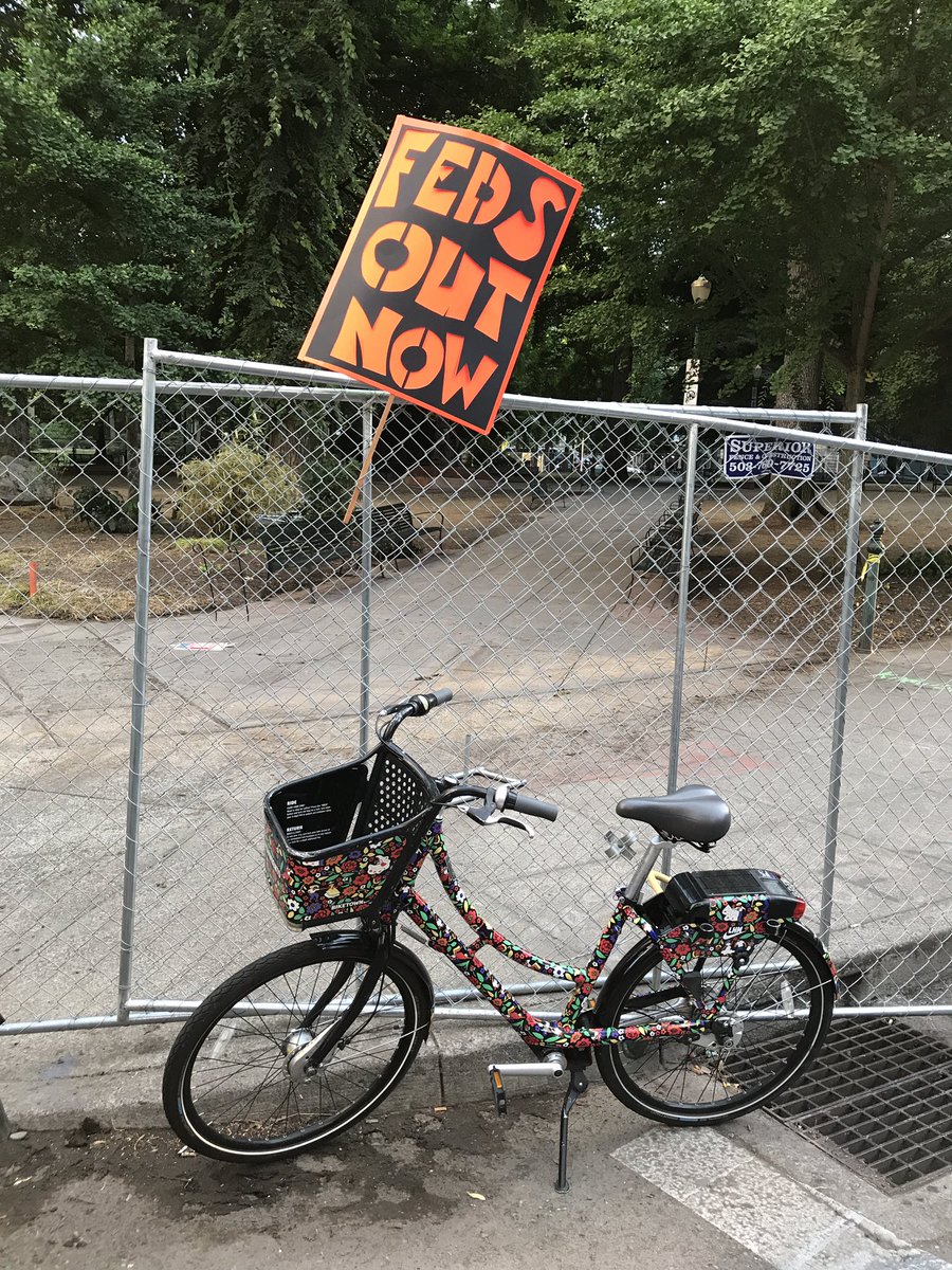 Someone rode a local  @BIKETOWNpdx bike to the Portland protest, and someone else abandoned their sign