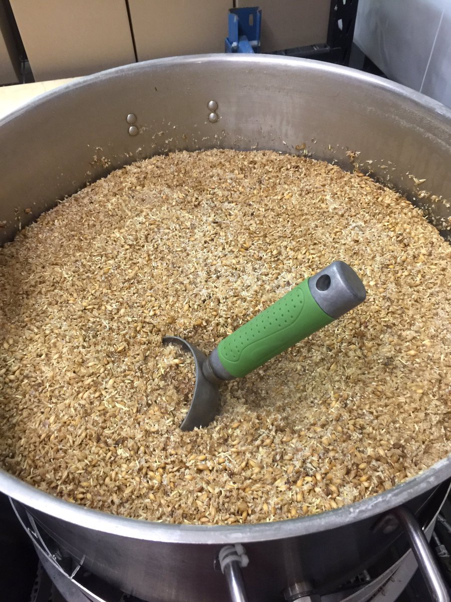 Now while we let the mash boil we clean up the spent grains. I think they sell the used grains for animal food