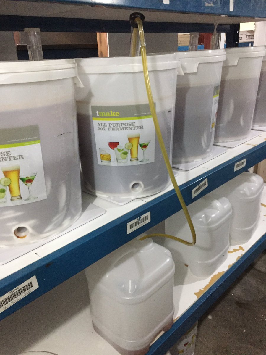 After a week, the mash has finished fermenting - so I unrack it, siphoning it into a sterile jerry can