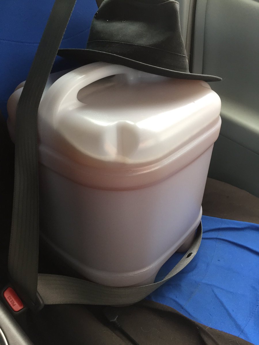 After a week, the mash has finished fermenting - so I unrack it, siphoning it into a sterile jerry can