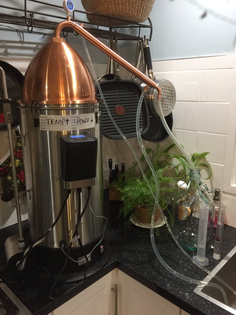 I picked up the still and my mash and brought home to distillShown here is the assembled still and my cat mittens - who doesn’t care about whisky 