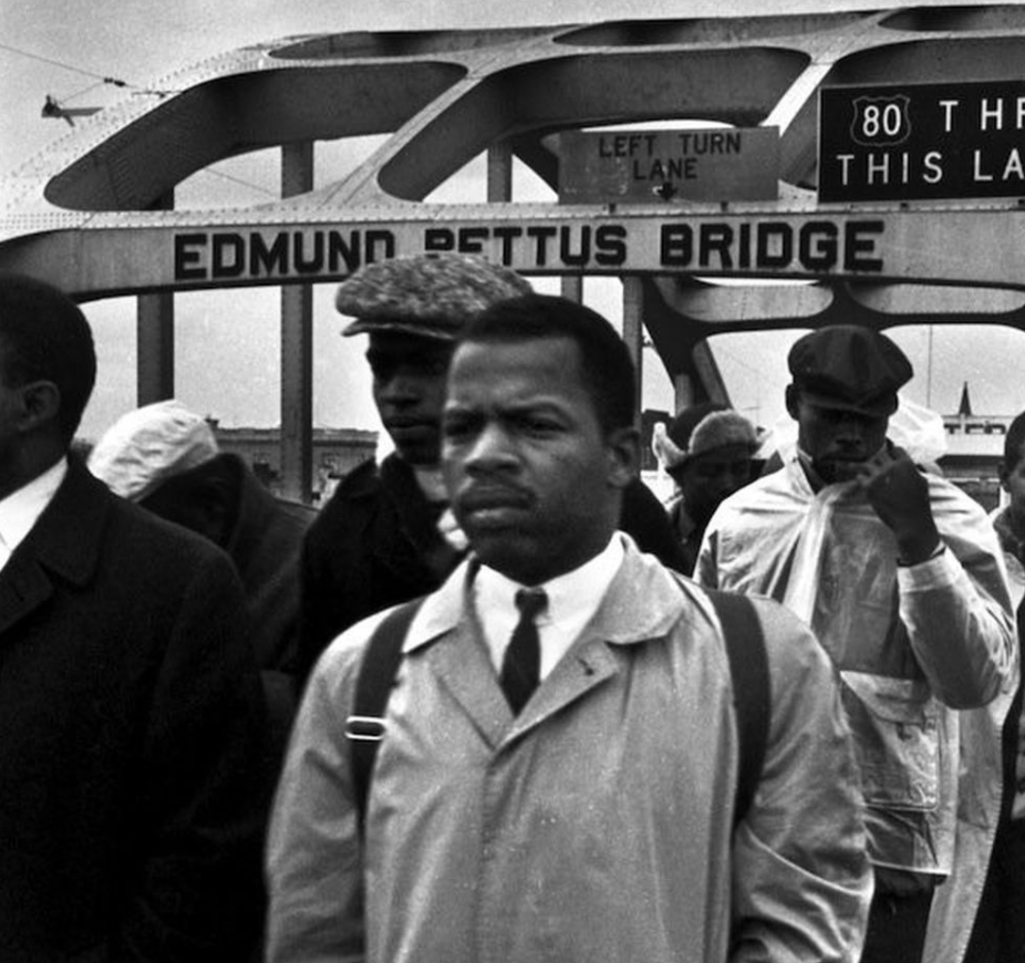 Photo of John Lewis on Bloody Sunday standing on the Edmund Pettus bridge.