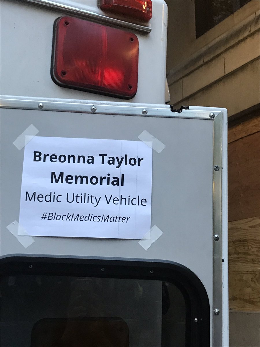 A medic vehicle that appears to be a former ambulance has arrived and is preparing to treat any potential injuries that could occur at the Portland protest