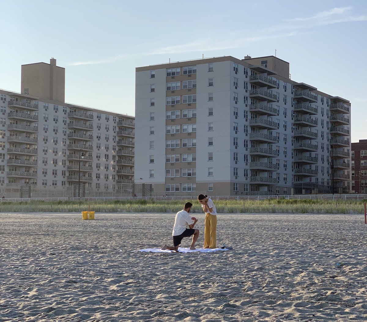 steinman_'s tweet photo. Quick change of pace...I was on the beach last night in Long Beach NY and saw this lovely engagement. I didn’t want to interrupt the moment but I think they should have this photo. Help me Internet! https://t.co/NhQ84ikT9T