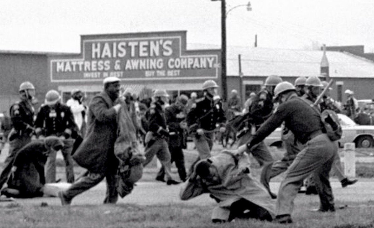 John Lewis was beaten so badly his skull was fractured. Before he was taken to hospital he appealed, via the television cameras, for the president, Lyndon B Johnson, to intervene. Photo shows Lewis being bludgeoned by a State Trooper.