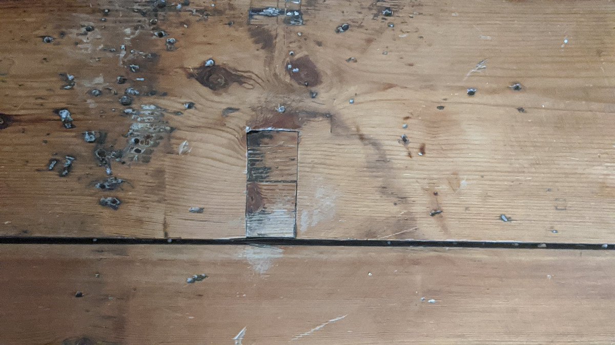 Interesting tide mark around a repair in our floorboards. Unlikely to be a problem, but interesting. Floorboards relaid, so it could be from somewhere else, maybe storage even. End grain exposed between infill so capillary action readily taking moisture up the grain.