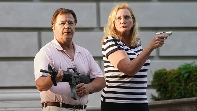thehill's tweet photo. St. Louis couple who pointed guns at protesters appear as guest stars during virtual Trump campaign event https://t.co/4MwdjW1vBR https://t.co/9NCeqNdEoI