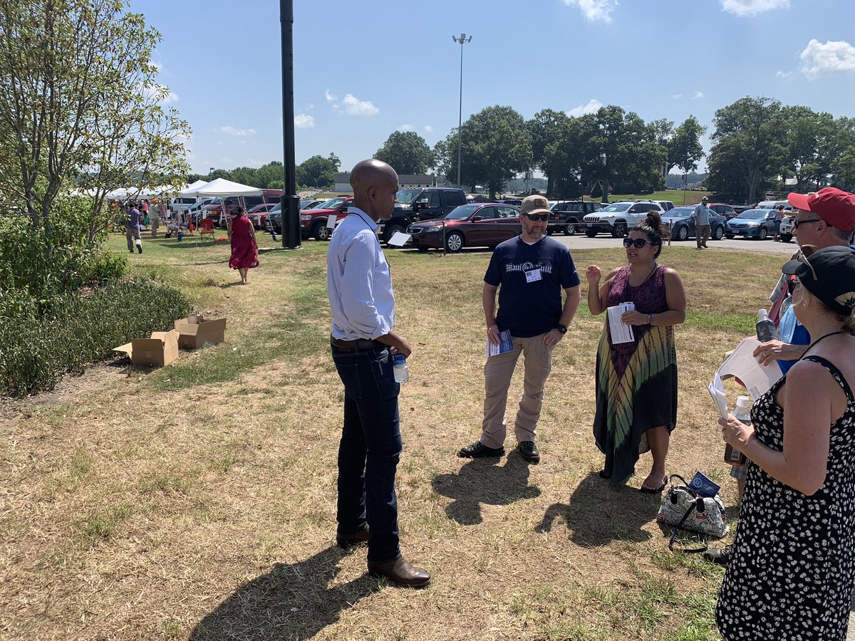 Andrew Knaggs is talking to people outside of the voting building. The first round of voting is over and they are currently counting. If no one receives a majority in the round, the bottom two candidates will be removed from the ballot and the delegates will vote again