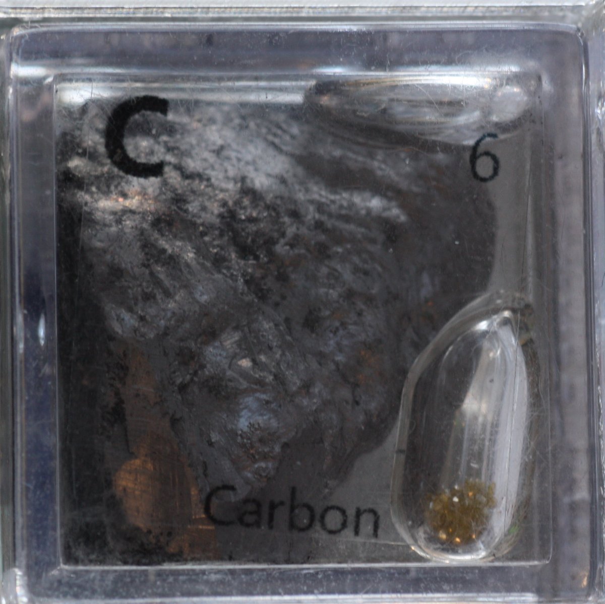 Carbon  #elementphotos. Pic 1: Large lump of natural graphite, plus industrial diamonds. Pic 2: Glassy carbon lump, diamonds, graphite powder, calcite (CaCO3) crystal. Pic 3: diamond and graphite.