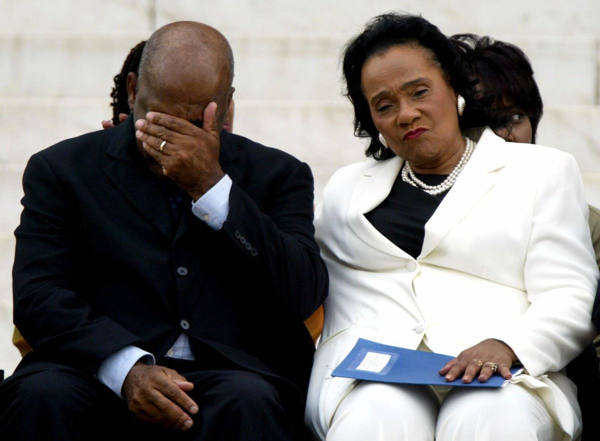 John Lewis and Coretta Scott King during a ceremony honoring Martin Luther King Jr. at the Lincoln Memorial in 2003. Photo by Paul J. Richards.  #JohnLewisRIP