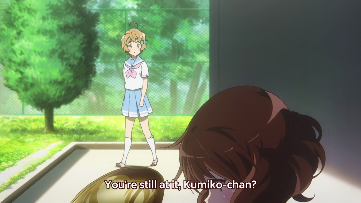 The light rising up means that Kumiko is improving. The blood dripping down from Kumiko's nose symbolizes her vitality. This means that Kumiko is putting her life, heart, and soul into her desire to improve. Since blood is red, this also represents her overwhelming passion.