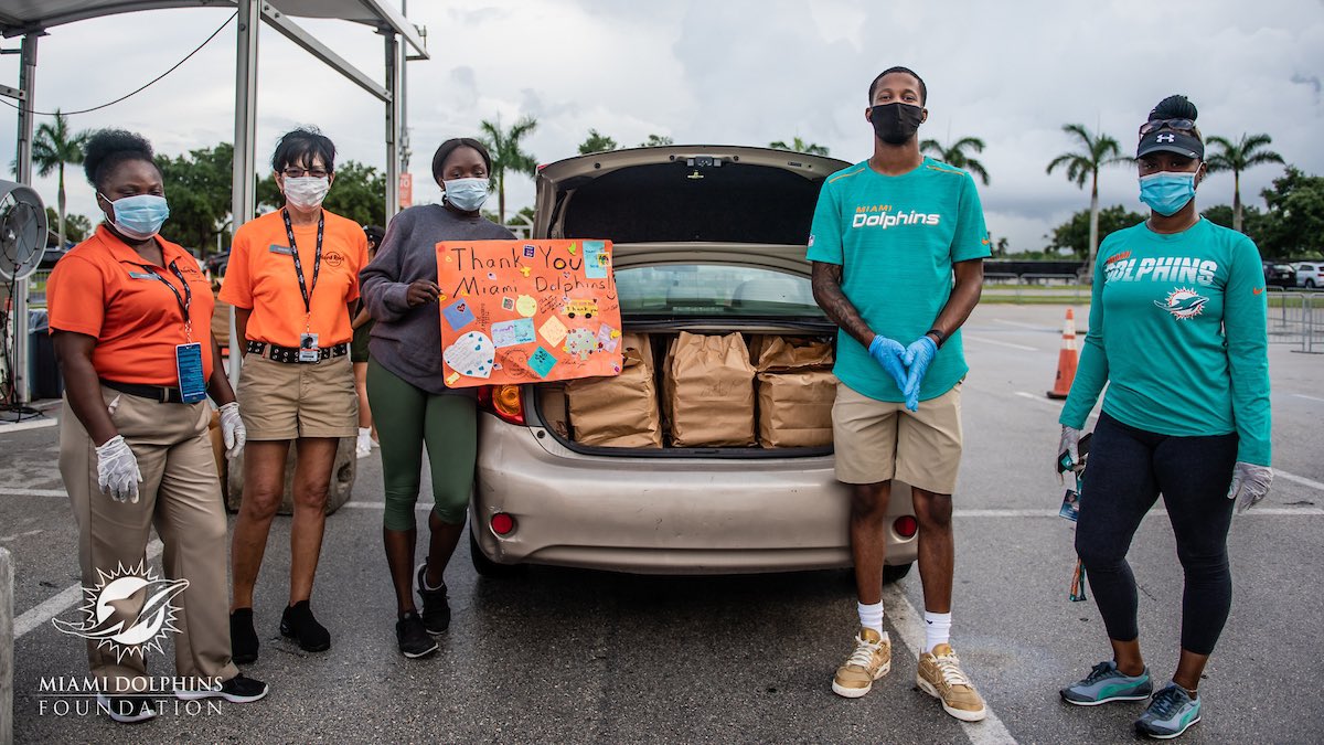 TackleCancer's tweet photo. Yesterday our staff came together with @FinsCommunity to distribute meals at @HardRockStadium to those in the need. #DolphinsMeals https://t.co/KpsTfU2Ugs