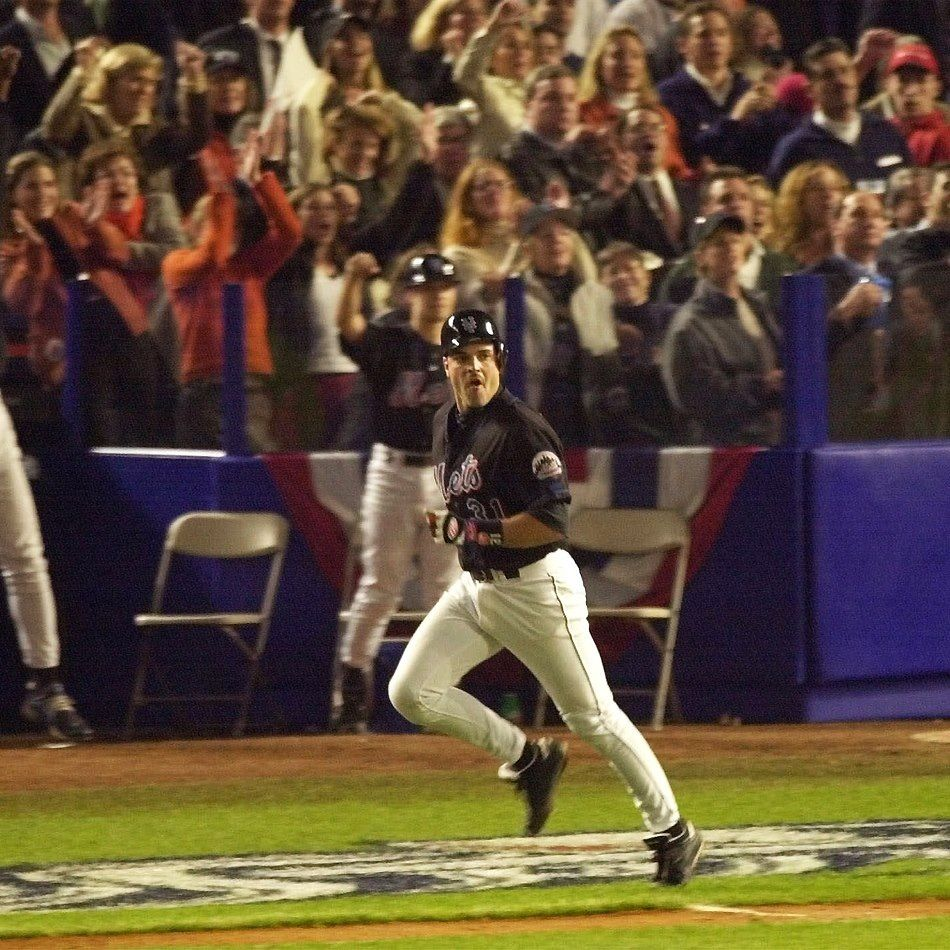 I've never heard a group yell as loudly as those 52,831 people did in that moment. Strangers hugged strangers. The ground beneath us shook. Shea Stadium swayed. And this kid yelled his heart out. Yelled so loud he almost fainted—as he waved his Mets flag he brought to every game.