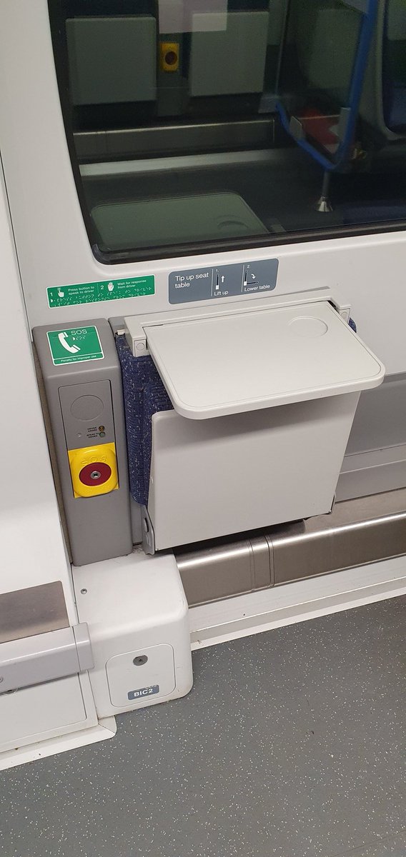 Next to each wheelchair space is a fold out table and a passenger alarm. In an emergency this let's you speak to the driver. &ndash; bei  Horsham Railway Station (HRH)