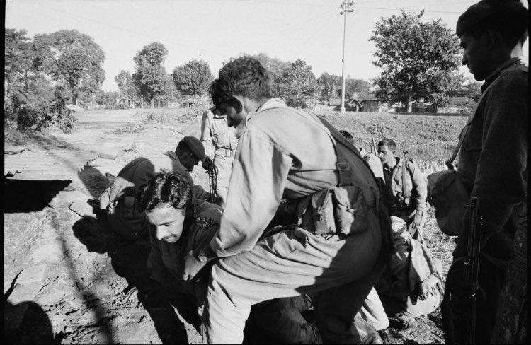 EAST PAKISTAN. Boda (north of Saidpur). December 1971. Captain leading from the front of the Pakistani army is evacuated after being wounded by incoming Indian artillery on the frontline.(5/20)