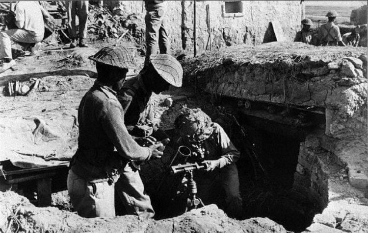 EAST PAKISTAN: Pakistani troops fire a mortar in a defensive emplacement 2,000 yards from the Indian troops occupying the village of Dangapara.(12/20)