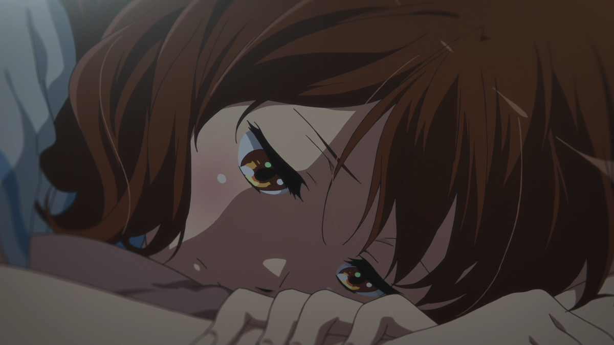 While at home, Kumiko grows increasingly frustrated which is amplified by the close-up shot. There's also the low shot angled up at Kumiko, with Kumiko being confined by a table and bed, showing how Kumiko feels more empowered at this moment despite the boundaries.