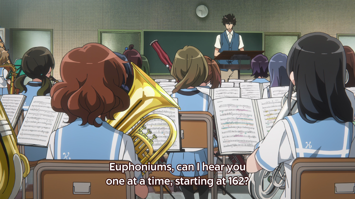When Taki asks Kumiko to play, she's framed as small and behind a bunch of band members, making her seem insignificant. This reflects how Taki views her playing at this moment and how Kumiko feels about herself, not up to par with what's needed for the band's success.