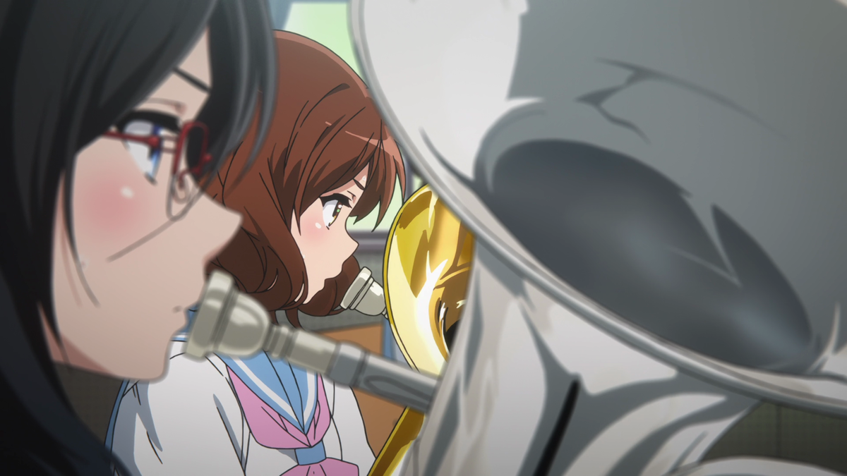 Kumiko being confined between Asuka and her euphonium shows how Kumiko still isn't up to par with the others. Taki takes note of this and asks Asuka to play the part alone.