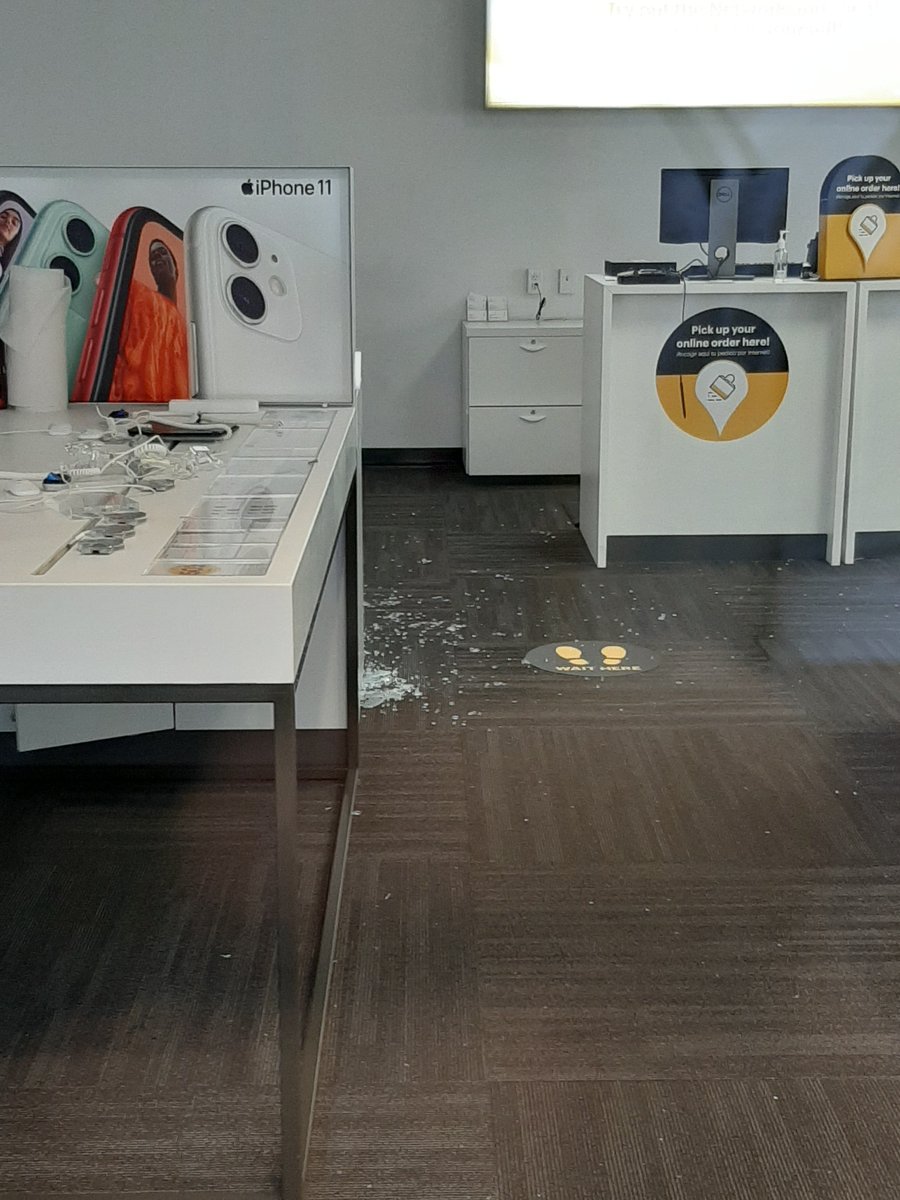 The  @sprint store had been broken into at some point in the last 50 days of protests. Broken glass was visible all over the store.