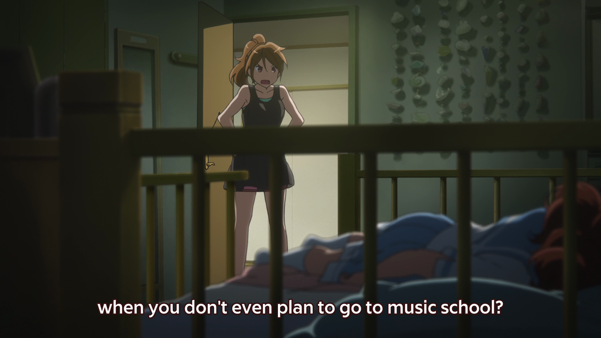 This is the moment where Kumiko breaks free from the boxes and prisons we've seen throughout the entirety of the episode. She confronts her sister and the visuals show her head moving above the bars as she admits her love for the euphonium!