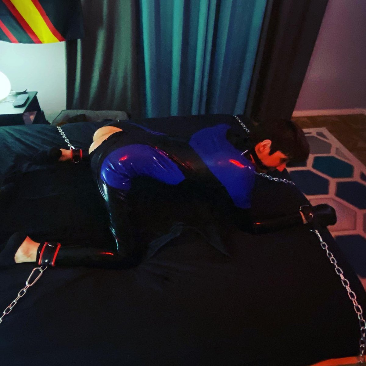 PupGleipnir's tweet photo. Bf @nathanm01837106 tied me down for some fun before locking me up in chastity. #latexpup #lockedpup https://t.co/7cnyQh6yYn