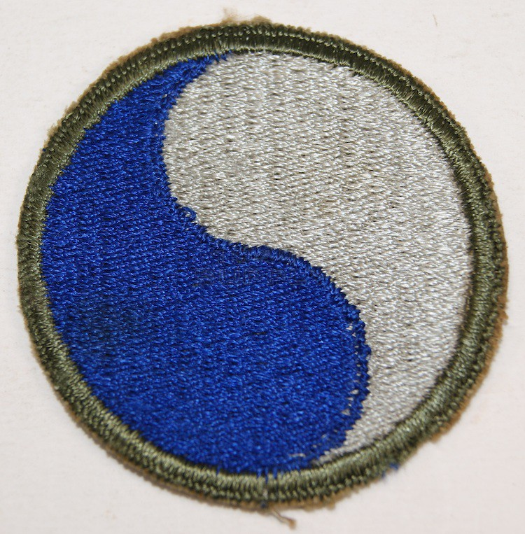 Bedford's "boys" were part of the 116th Regiment, 29th Division. It's a National Guard unit that was federalized just before WWII started for us. The unit patch symbolizes that members were from Virginia & Maryland. 3/