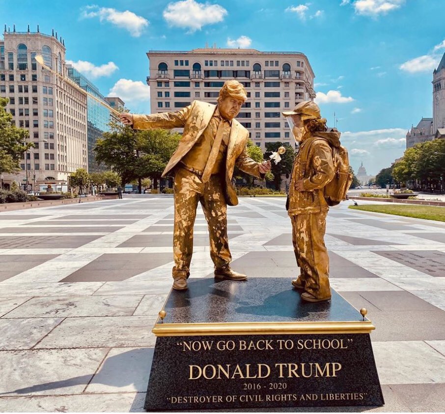 The second Trump statue, which is part of “The Destroyer of Civil Rights and Liberties” series, is of Trump holding a golf club and offering a child a lollipop, while telling them to go back to school. (2/3)