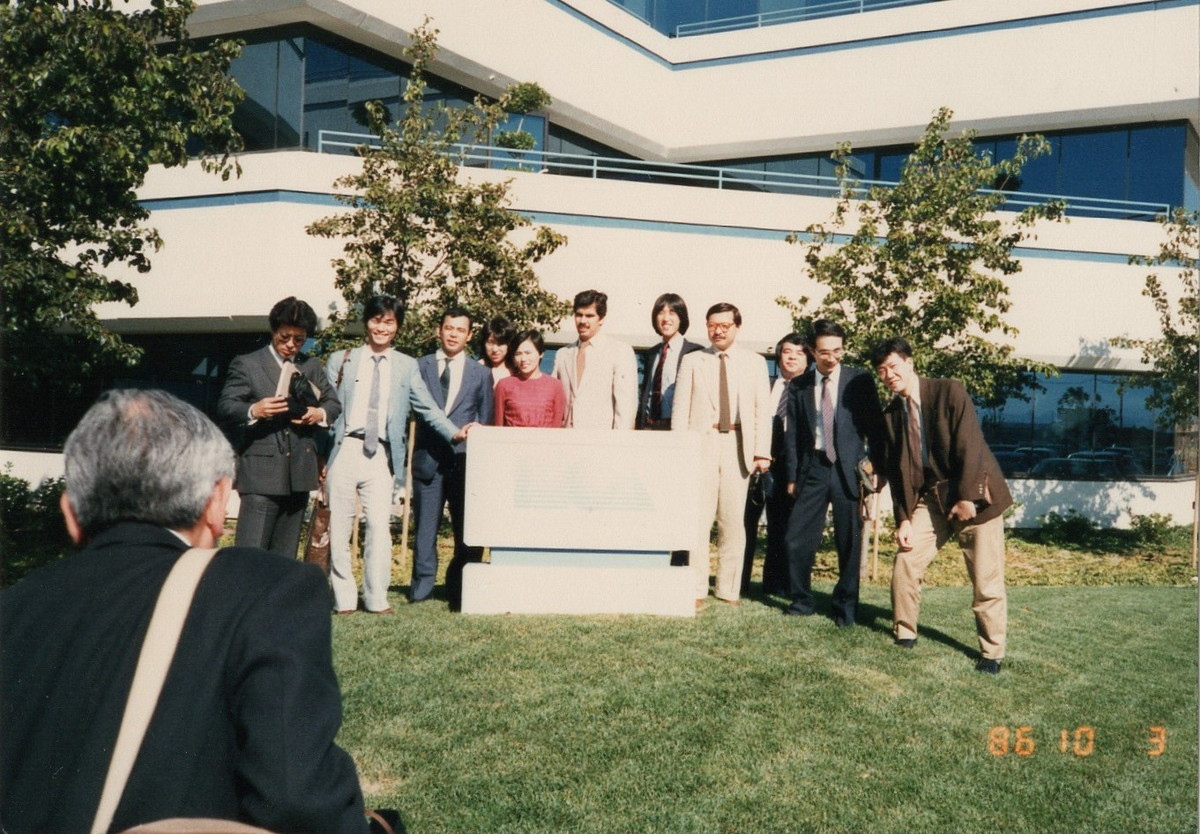 Apparently members of this group would visit Silicon Valley game companies on yearly trips! Here's a bunch of them in front of Electronic Arts in 1986, and Sakaguchi and Tanaka at Broderbund in the same year. (Source:  https://www.resetera.com/threads/old-photos-of-pre-1987-square-featuring-young-sakaguchi-w-o-mustache-and-others.121767/)