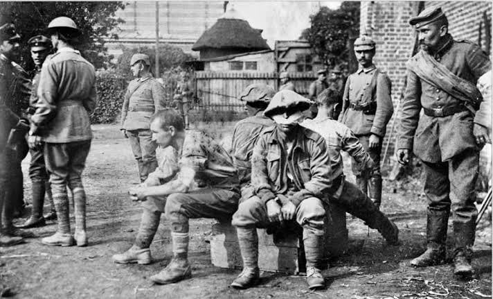 4. Australians taken prisoner in a village behind the lines...