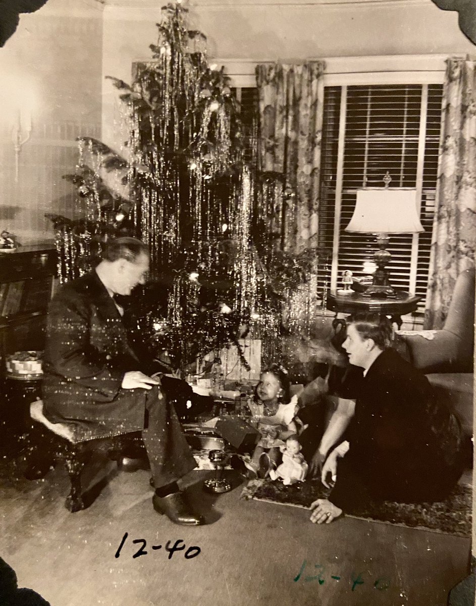 So many of their photos aren’t posed but more candid. Here Charles is with his son my grandfather Richard at Christmas 1940. The bookcase behind him is in my living room right now. Don’t know the little girl.