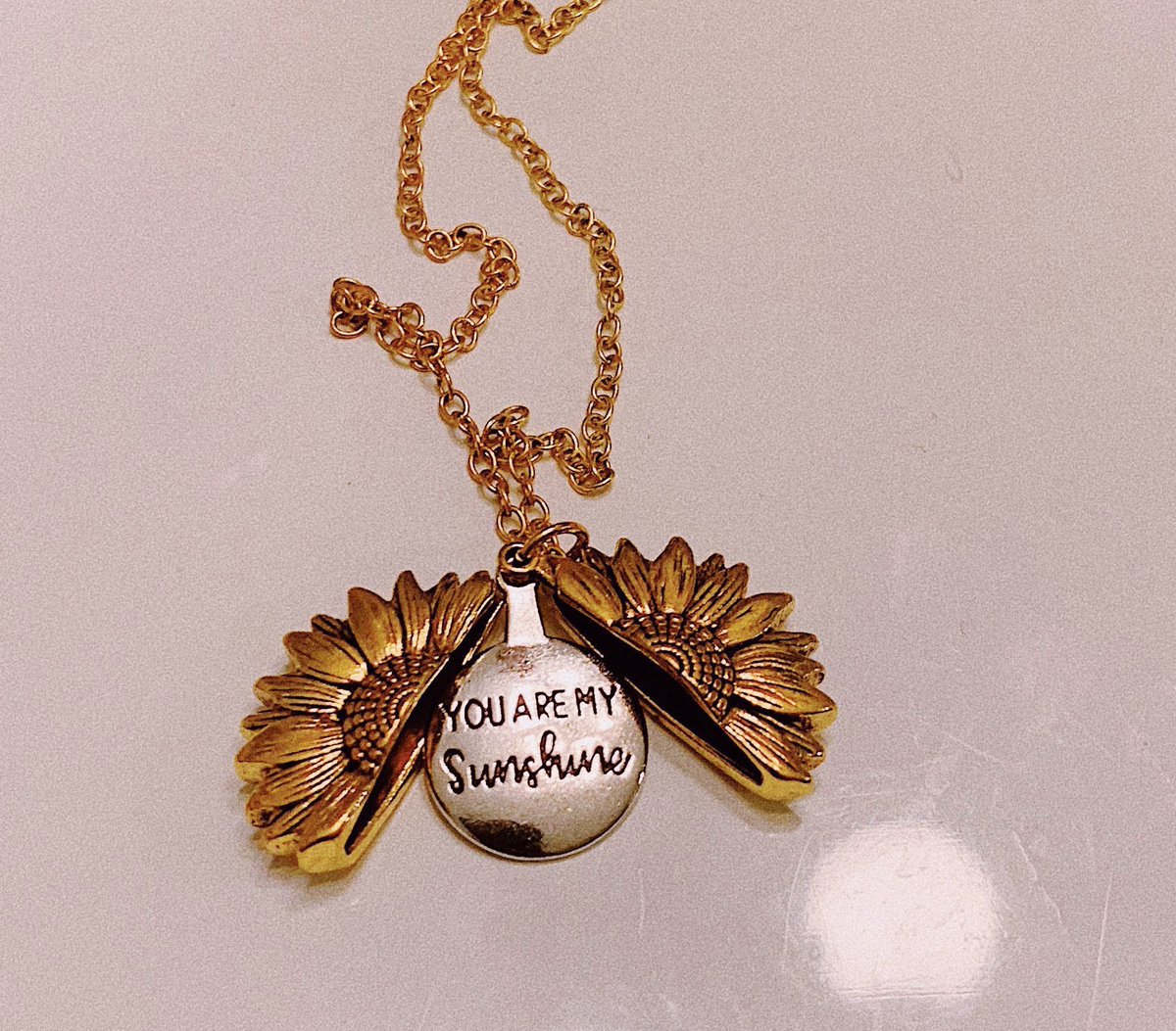 rakil_'s tweet photo. babe got me this sunflower necklace that opens up to say you are my sunshine 🌞😍 I'm so in love💛 https://t.co/qNGYYgm2Bk
